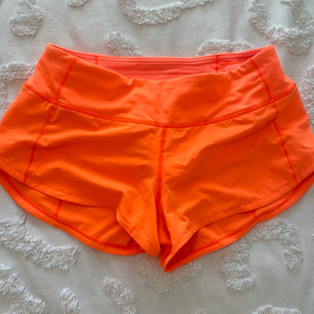 orange lululemon speed ups 2.5 inseam size 4